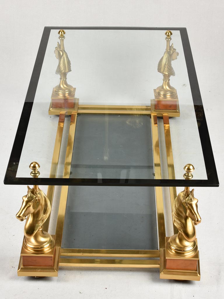 1970s glass coffee table with horse heads 47¾"