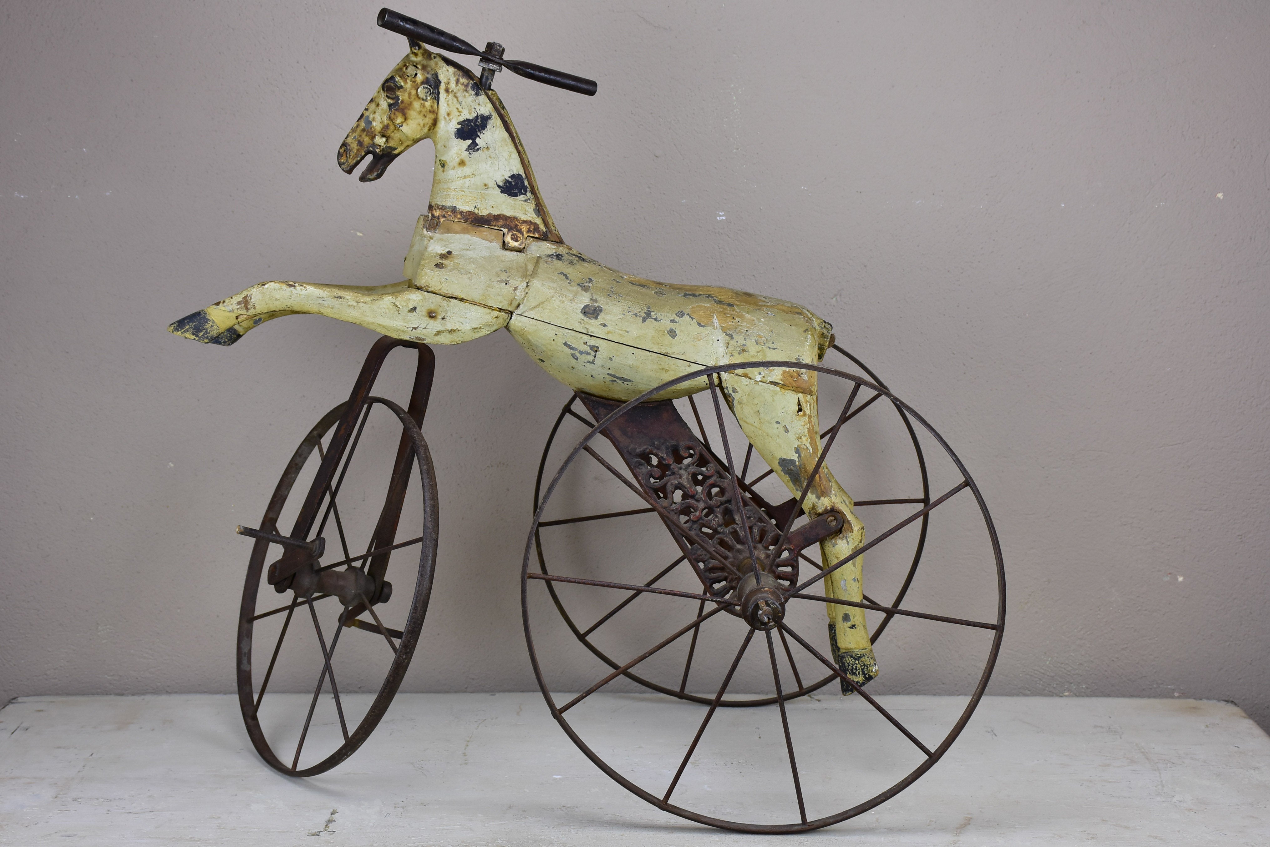 Antique French toy horse tricycle