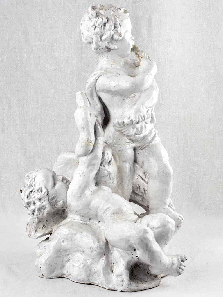 Terracotta sculpture of two infants w/ goose & horn 25½"