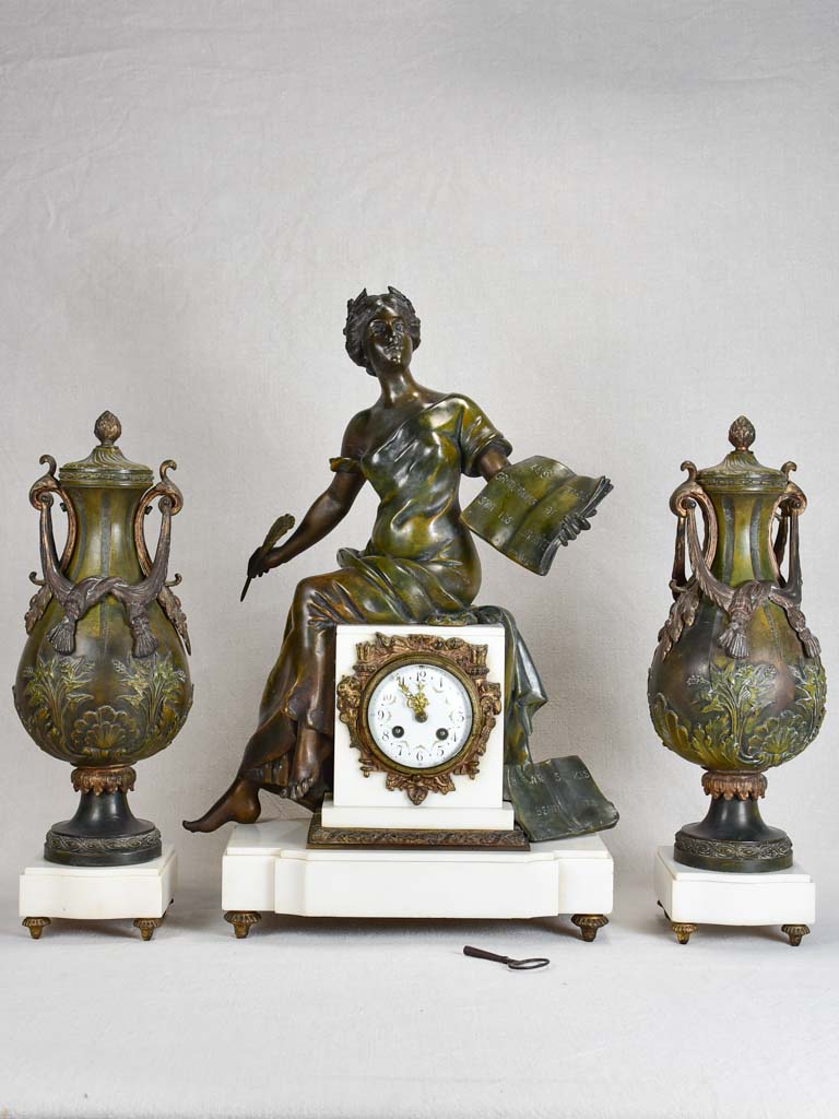 Napoleon III mantle clock with matching ornamental urns