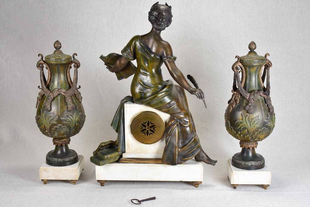 Napoleon III mantle clock with matching ornamental urns