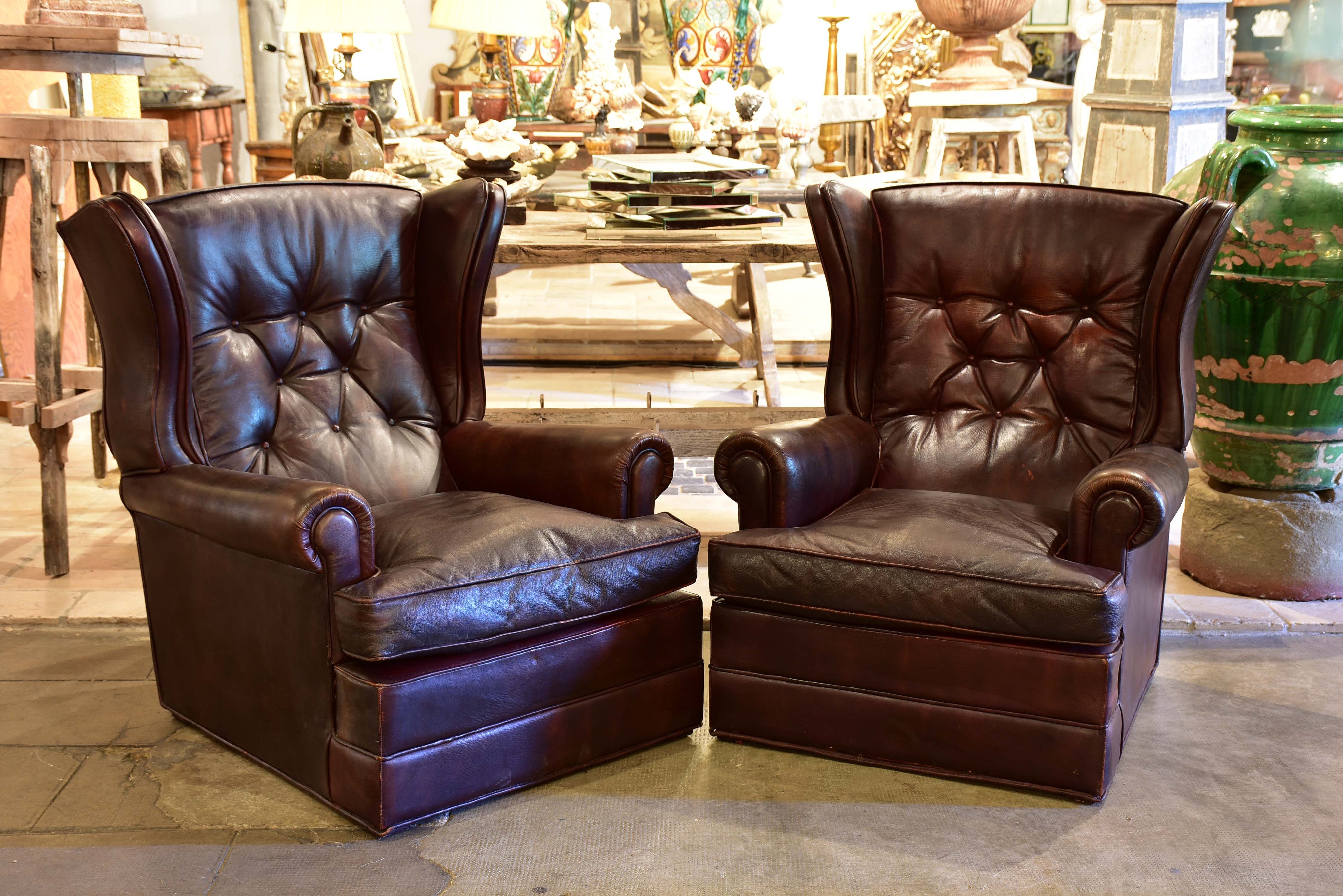 Pair of 1950’s leather wingback armchairs