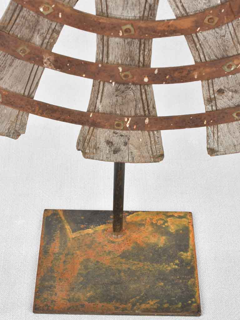 Antique sunburst sculptures on iron base
