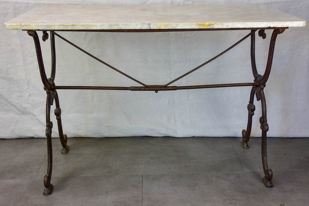Late nineteenth century French marble presentation table with cast iron base 23¾" x 40½"