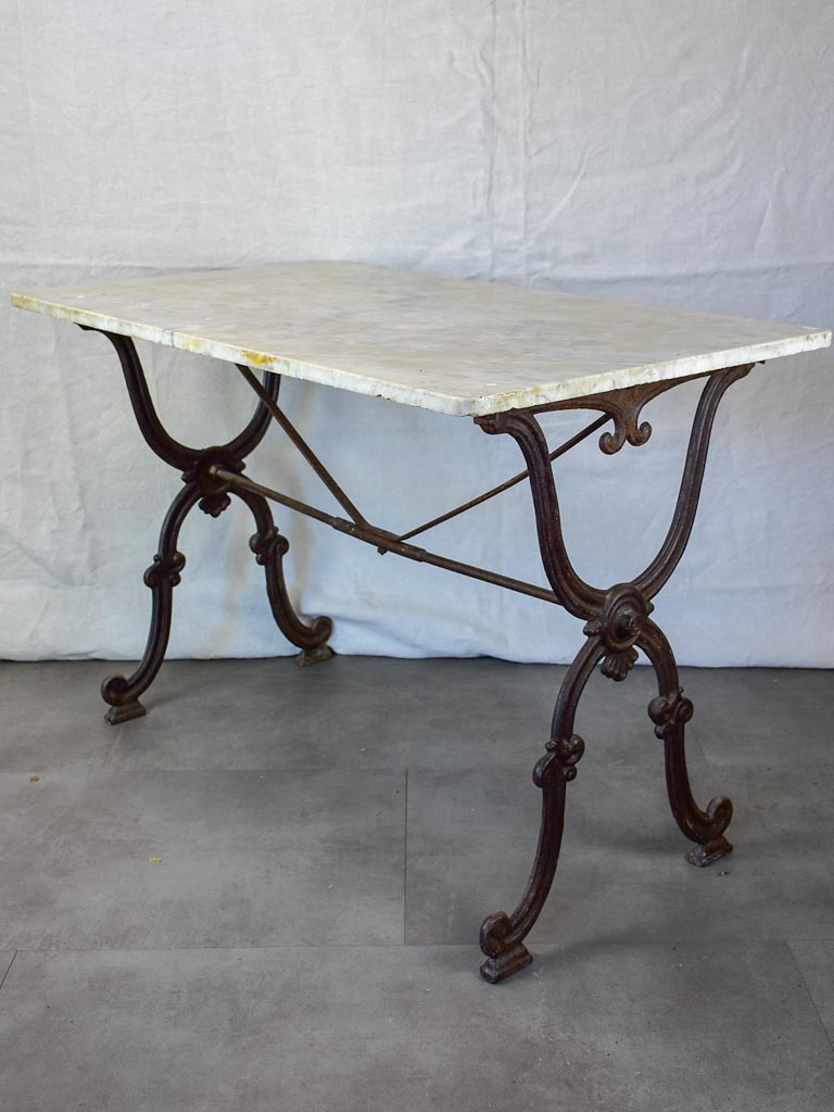Late nineteenth century French marble presentation table with cast iron base 23¾" x 40½"