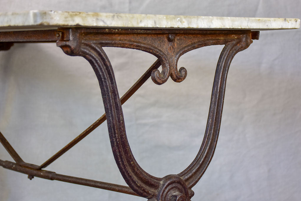 Late nineteenth century French marble presentation table with cast iron base 23¾" x 40½"