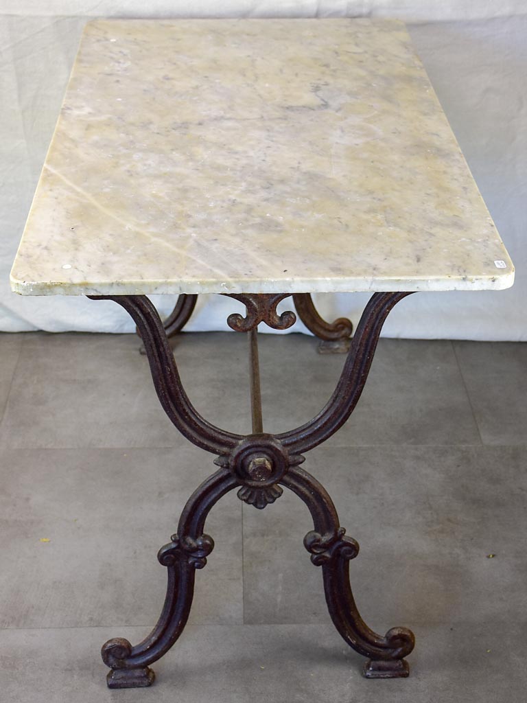 Late nineteenth century French marble presentation table with cast iron base 23¾" x 40½"