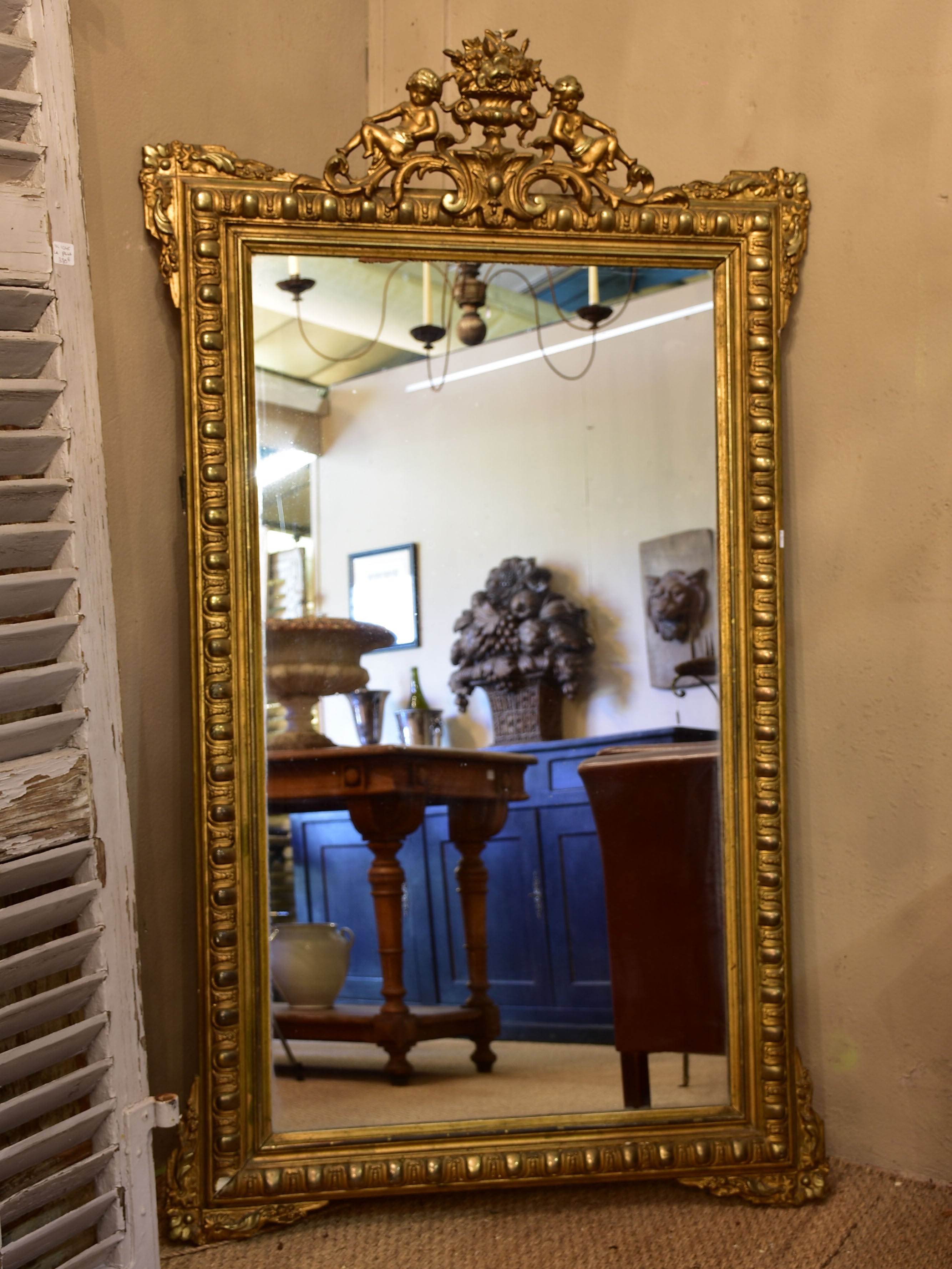 Antique French Regence mirror with gilded frame