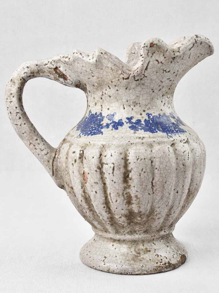 Rustic glazed terracotta wine pitcher