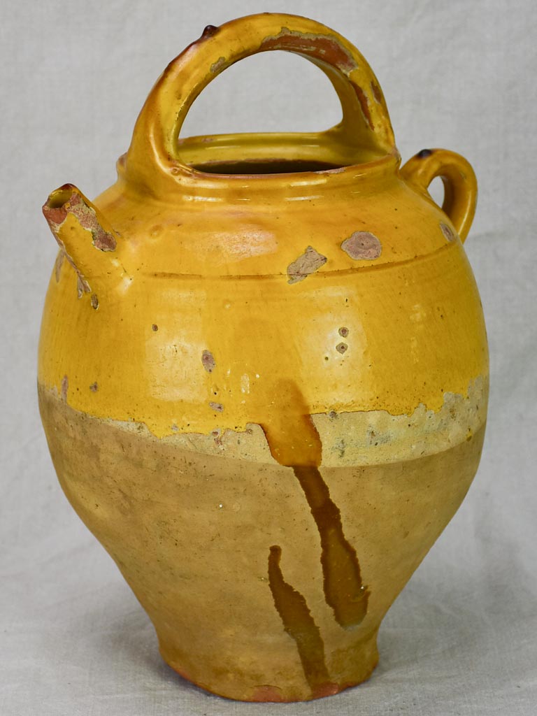 Antique French water cruche with yellow glaze