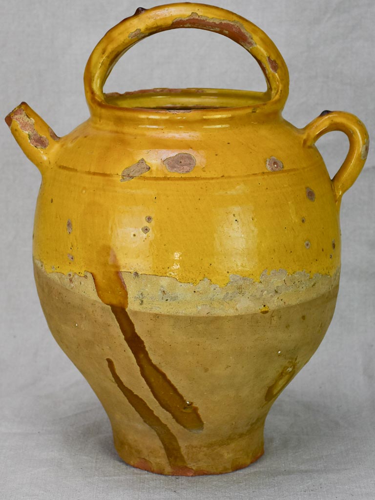 Antique French water cruche with yellow glaze
