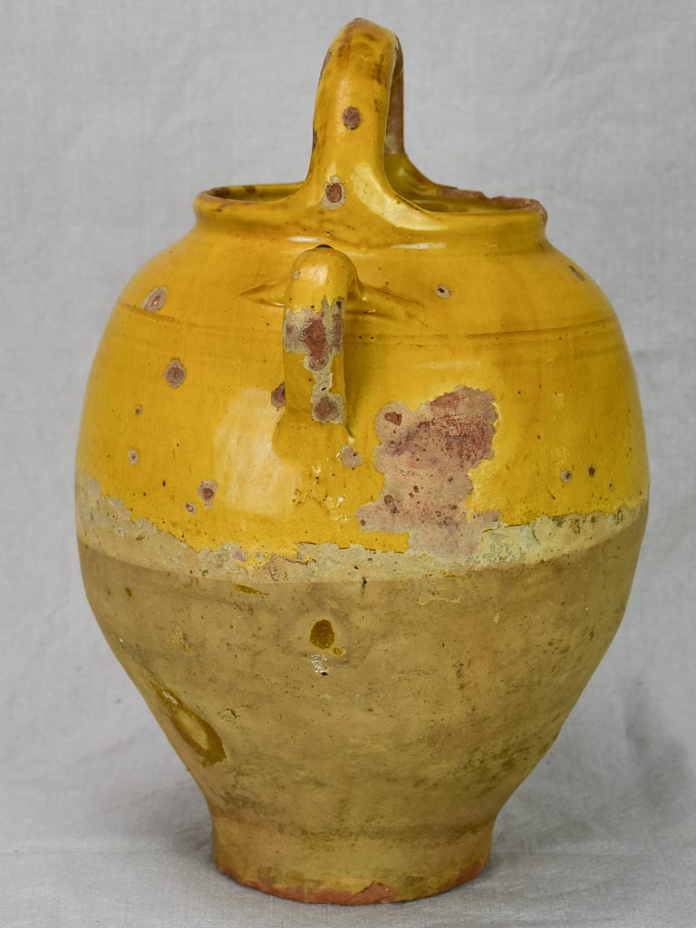 Antique French water cruche with yellow glaze