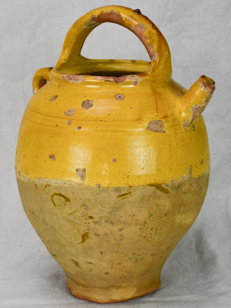 Antique French water cruche with yellow glaze
