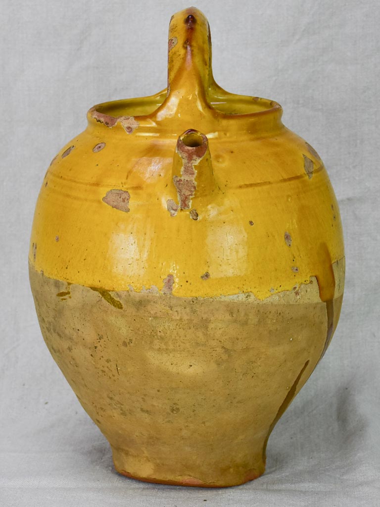 Antique French water cruche with yellow glaze