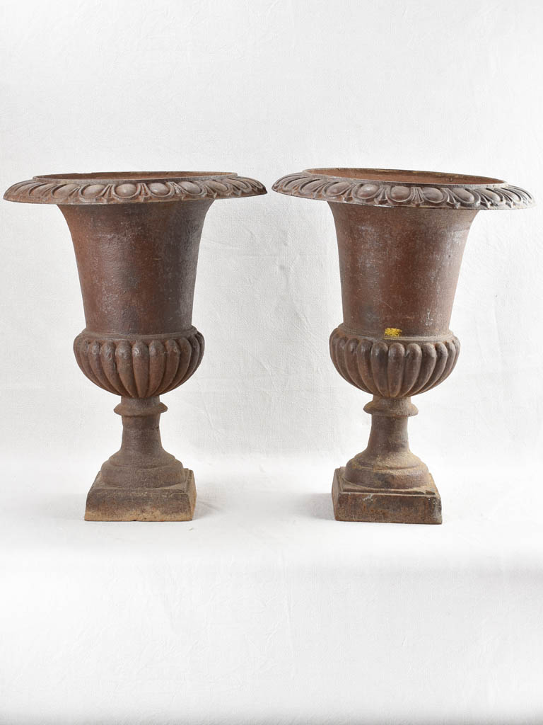 Pair of large antique cast iron Medici planters 25¼"