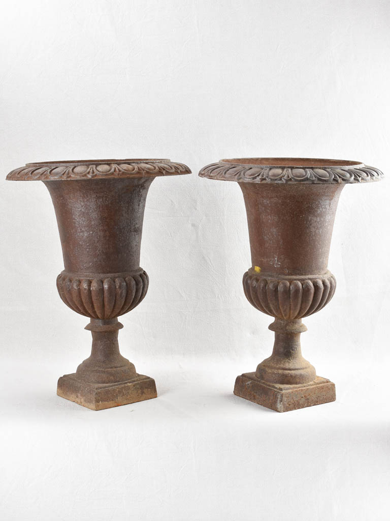 Pair of large antique cast iron Medici planters 25¼"