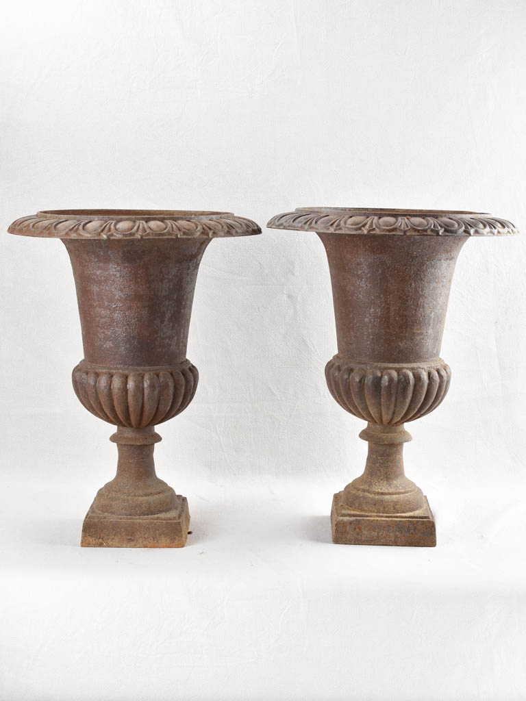 Pair of large antique cast iron Medici planters 25¼"