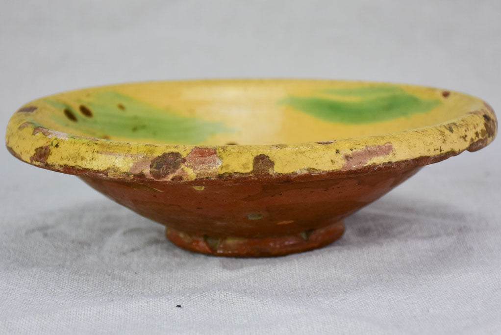 Antique French fruit strainer with yellow and green glaze 9"