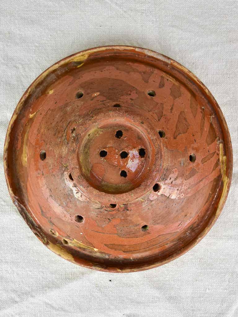 Antique French fruit strainer with yellow and green glaze 9"