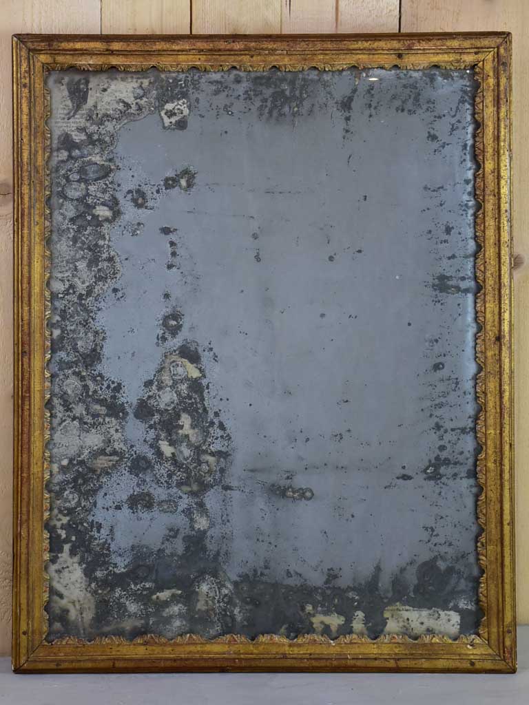 Nineteenth century French mirror with gilded frame and heavily aged glass 22½" x 28¾"