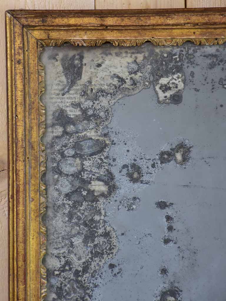 Nineteenth century French mirror with gilded frame and heavily aged glass 22½" x 28¾"