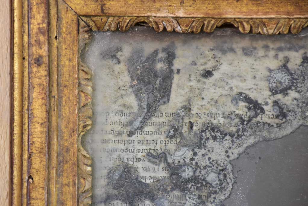 Nineteenth century French mirror with gilded frame and heavily aged glass 22½" x 28¾"