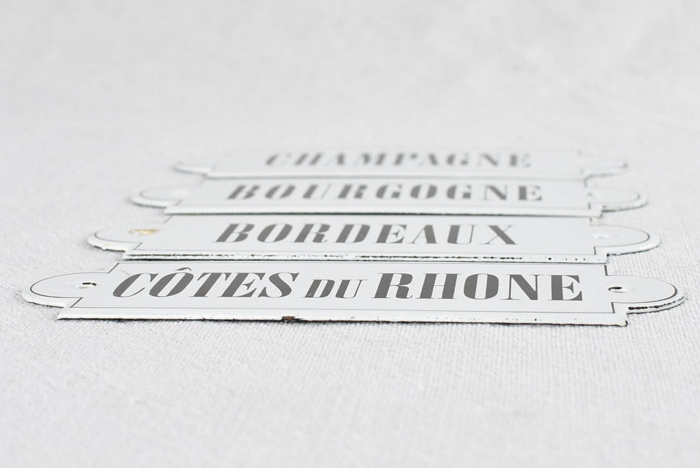 Collection of four enamel French wine appellation labels