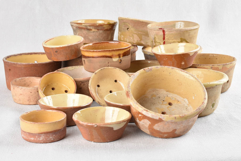 Collection of 21 terracotta cheese strainers 'faisselles'