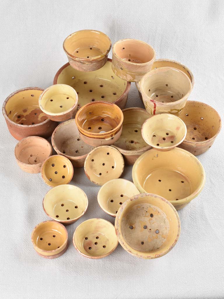Collection of 21 terracotta cheese strainers 'faisselles'