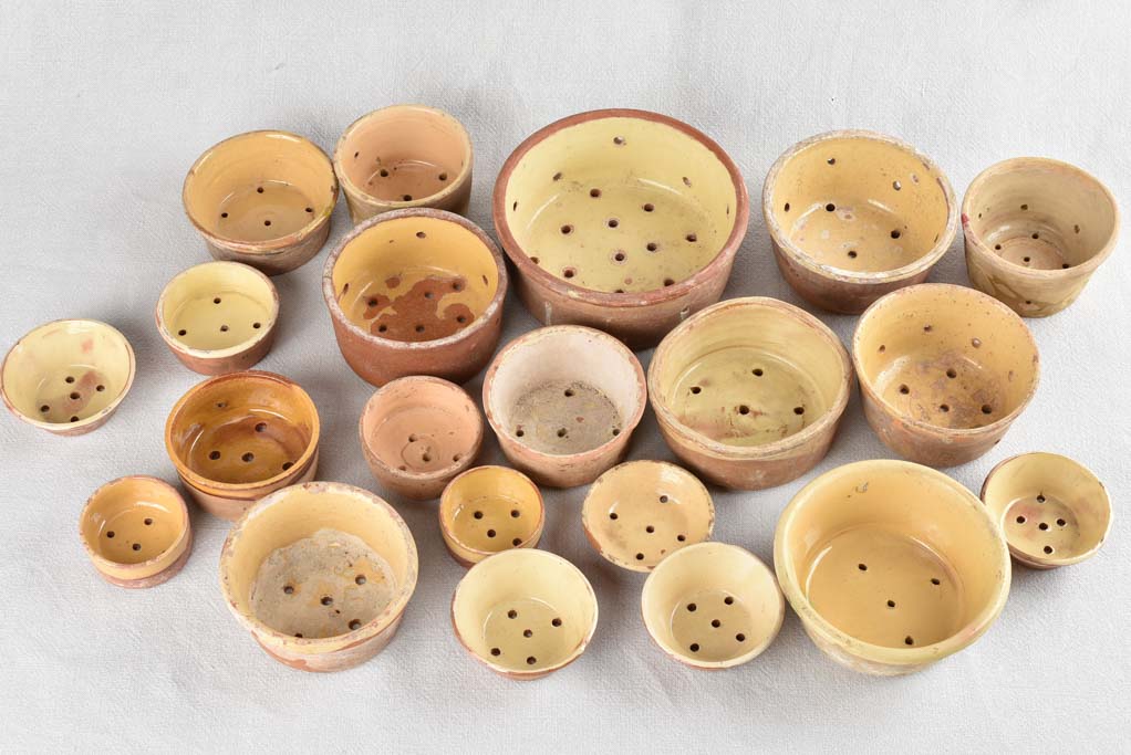 Collection of 21 terracotta cheese strainers 'faisselles'