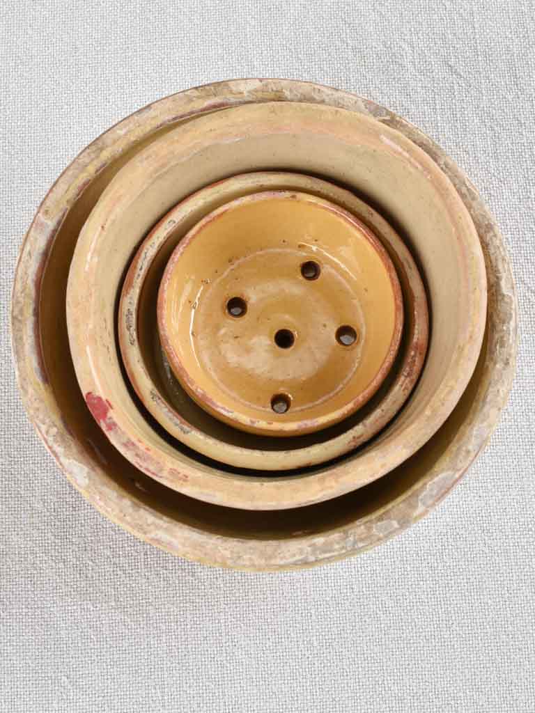 Collection of 21 terracotta cheese strainers 'faisselles'