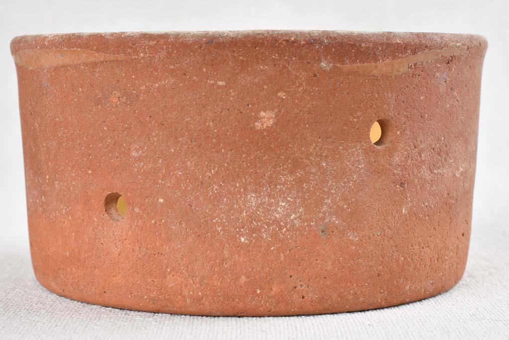 Collection of 21 terracotta cheese strainers 'faisselles'