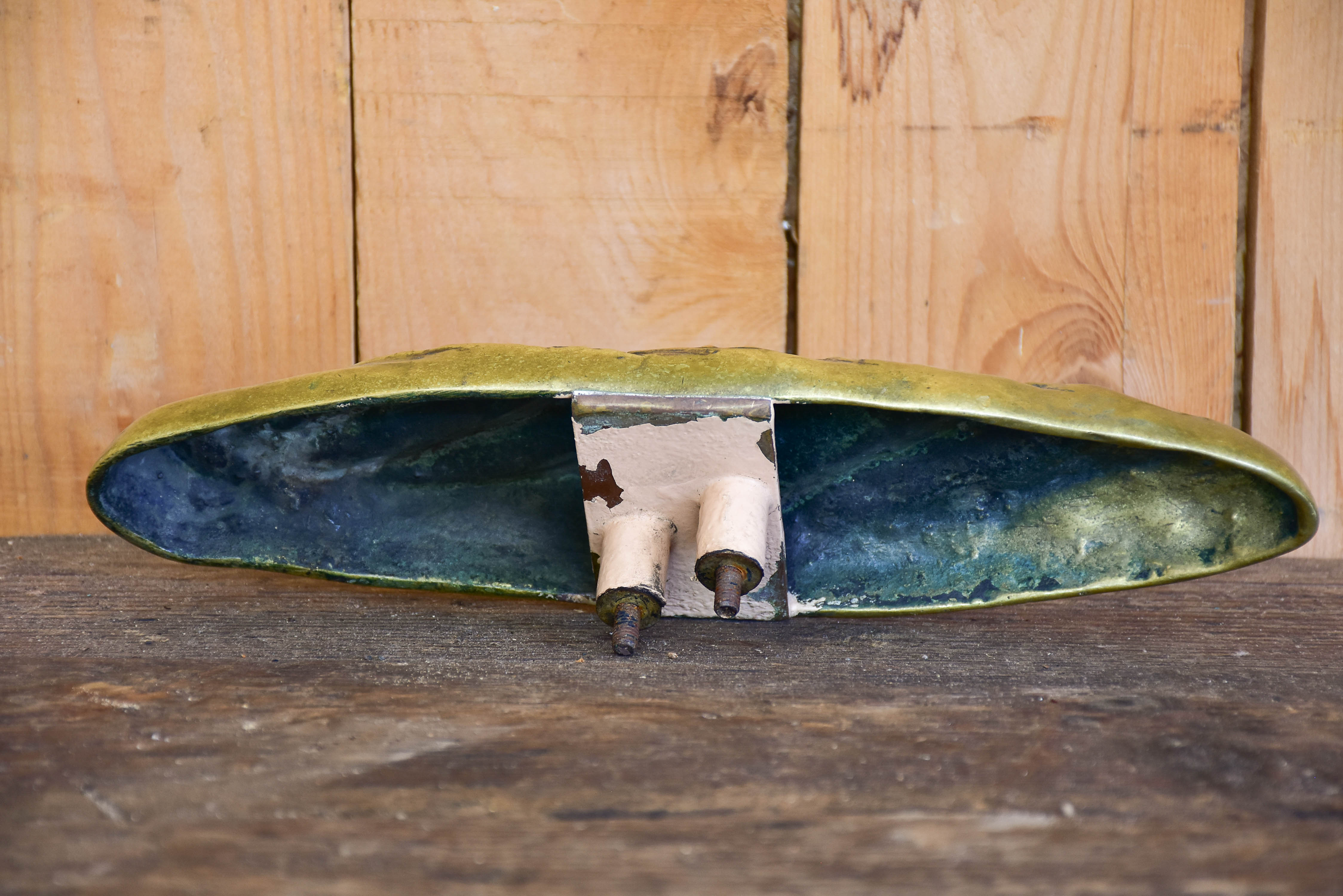 Vintage door handle from a boulangerie in the shape of a baguette