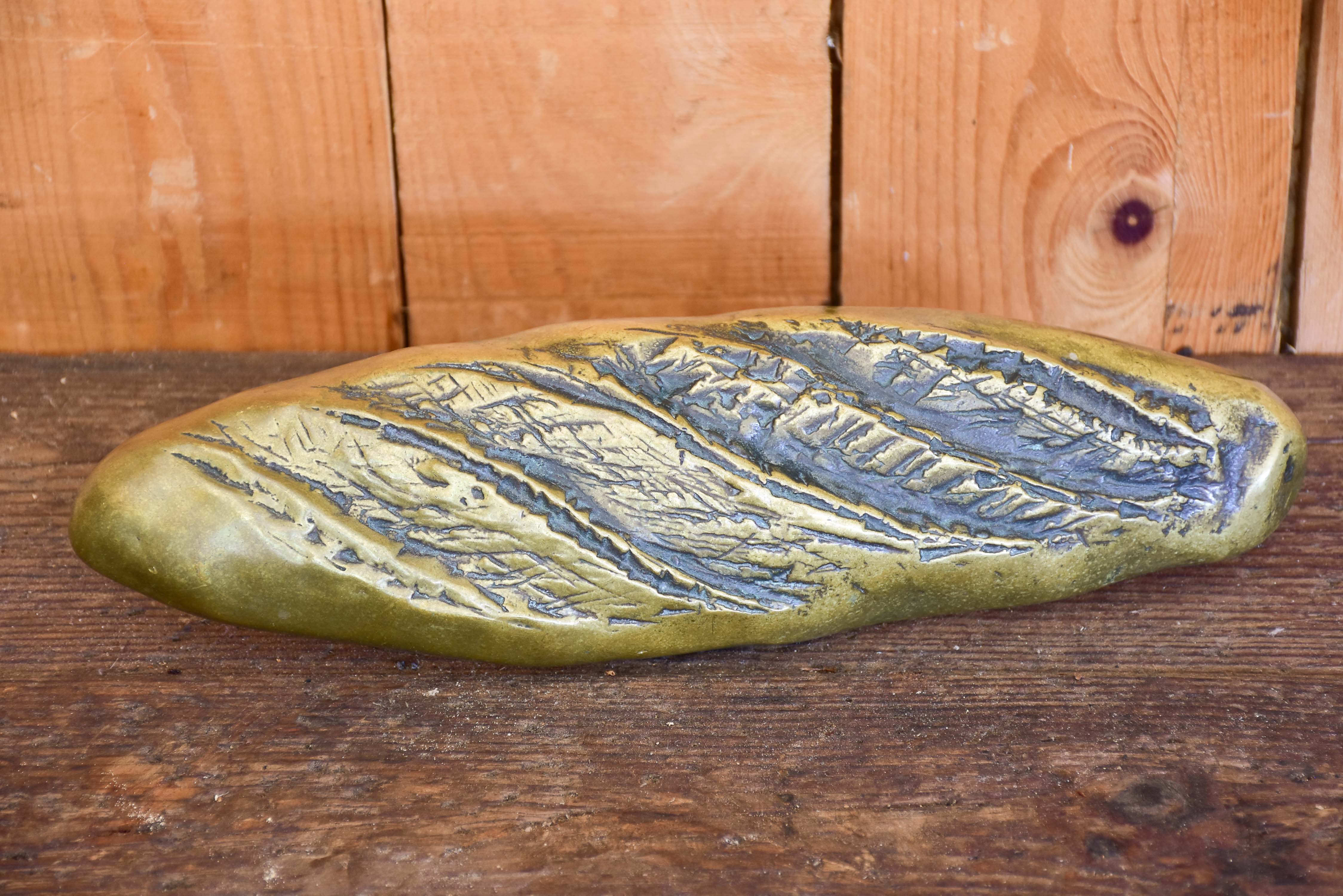 Vintage door handle from a boulangerie in the shape of a baguette