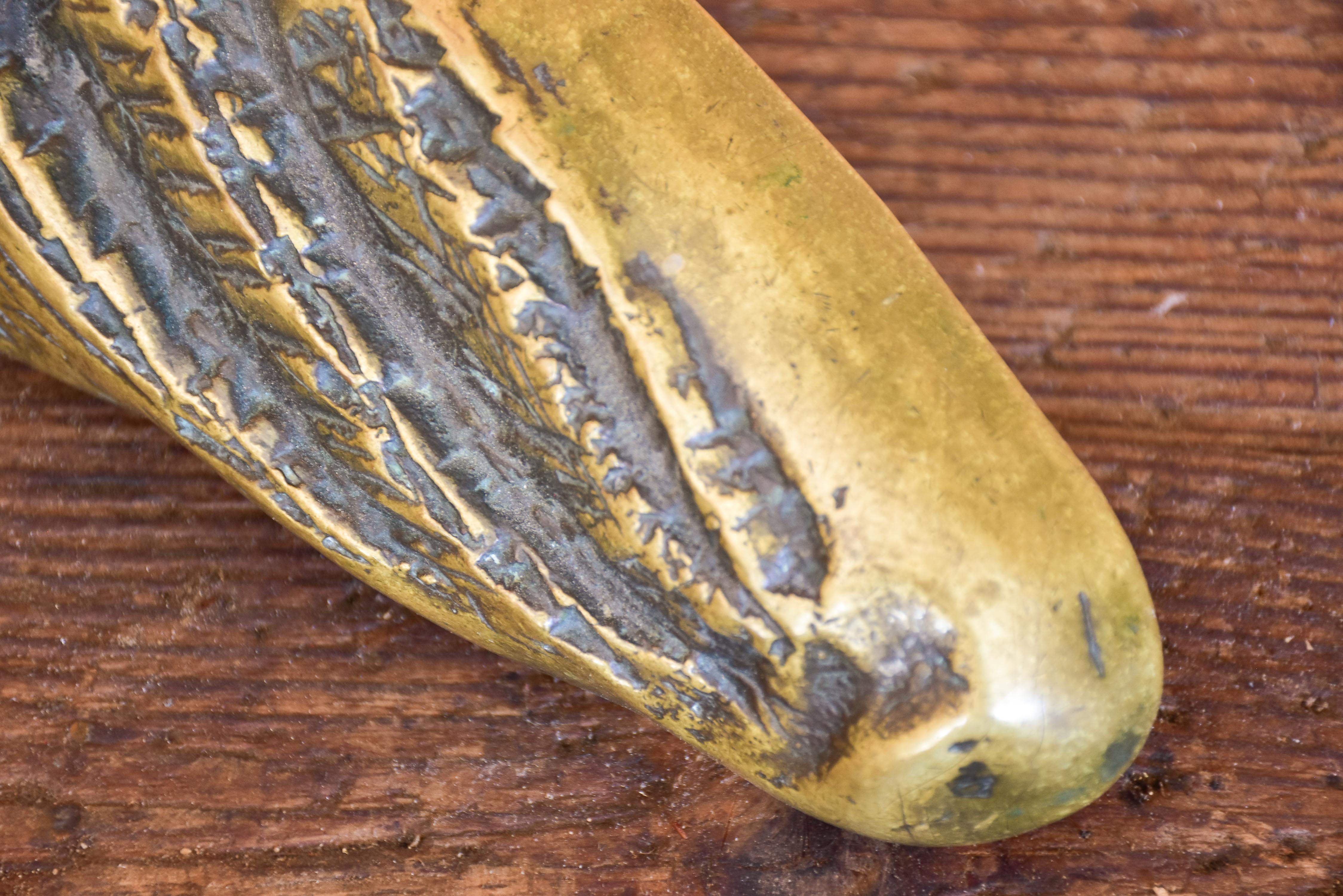 Vintage door handle from a boulangerie in the shape of a baguette