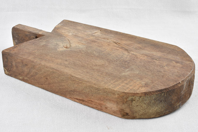 Antique French cutting board w/ rounded bottom & pointed shoulders 19¼" x 10¼"