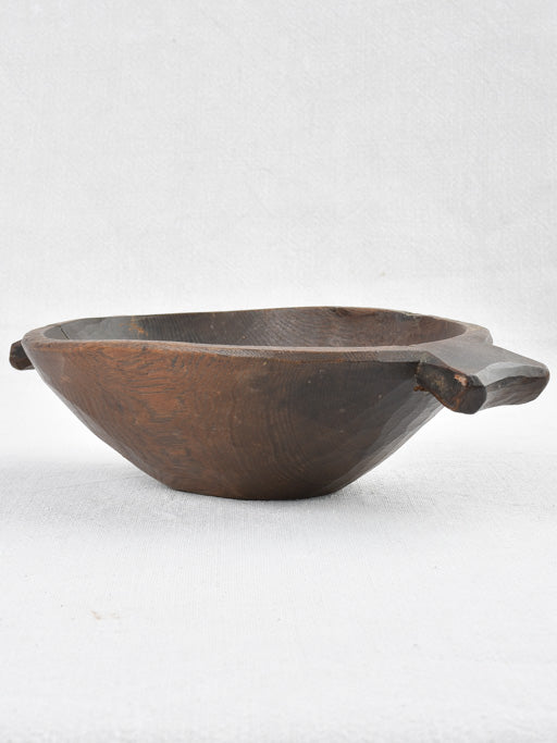 Small primitive wooden bowl w/ fishtail handles 11"
