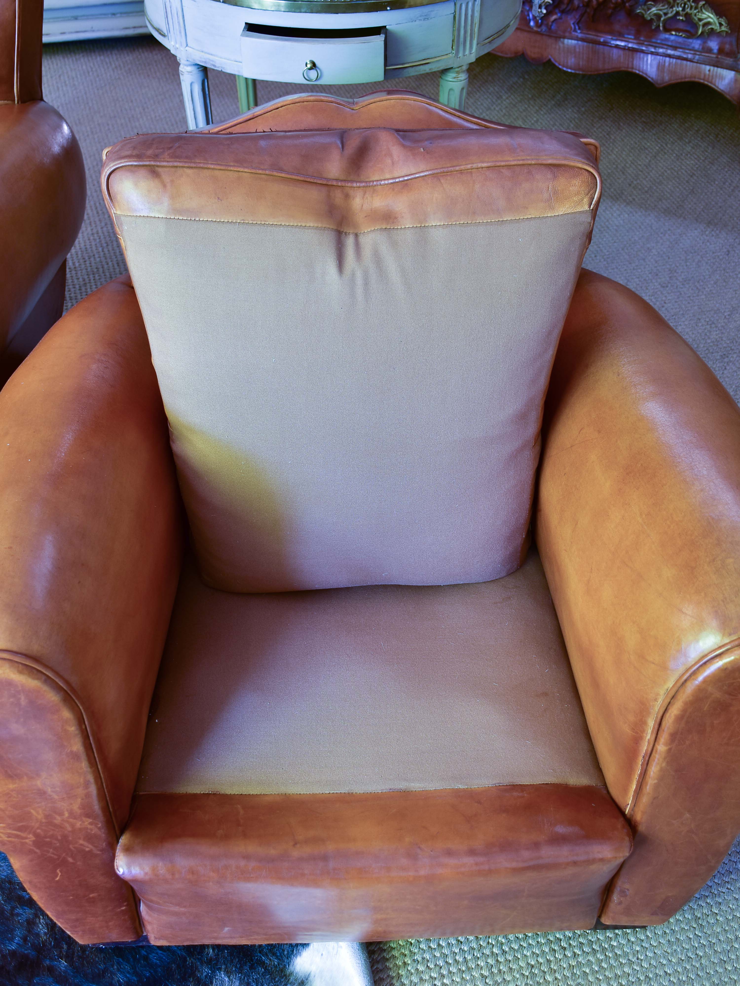 Pair of 1950's moustache back leather club chairs