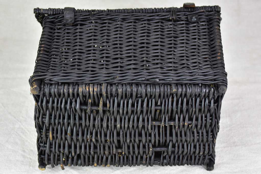 Black wicker lunch basket with two handles
