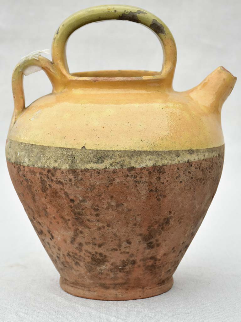 Small antique French water pitcher with yellow glaze 11"