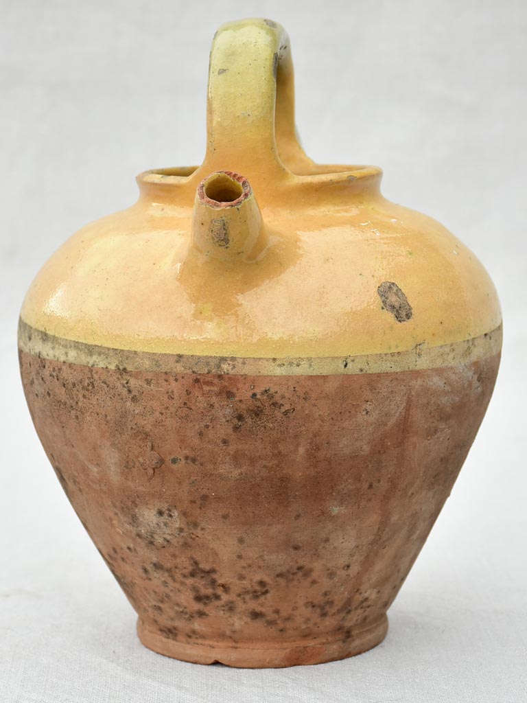 Small antique French water pitcher with yellow glaze 11"