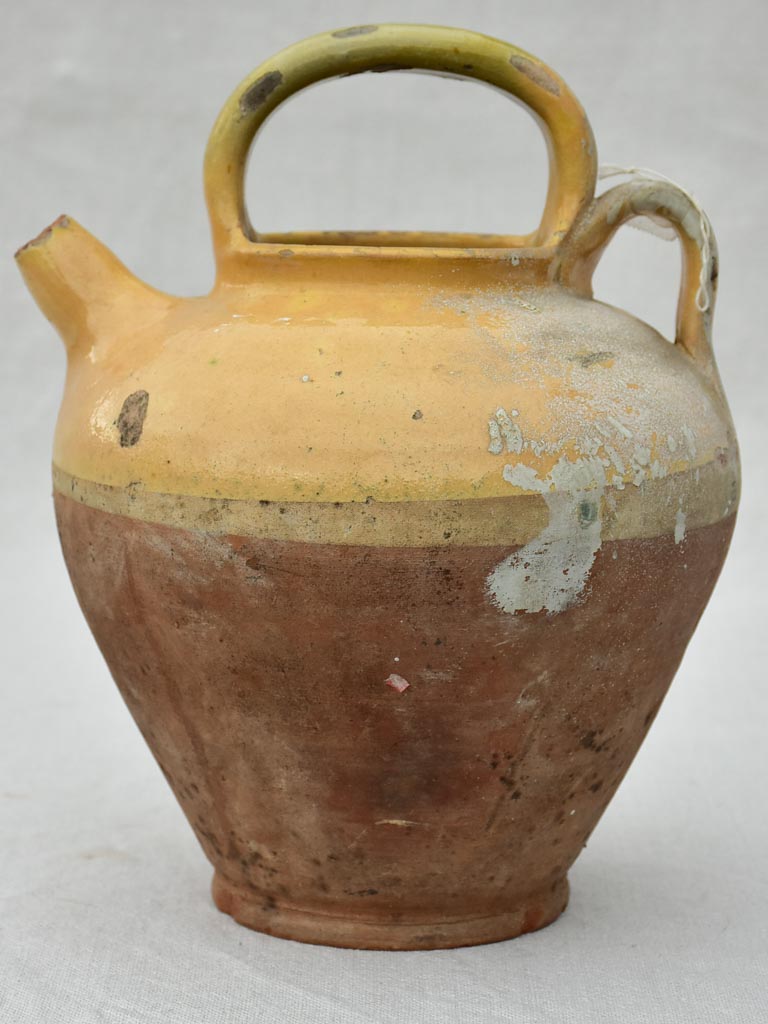 Small antique French water pitcher with yellow glaze 11"