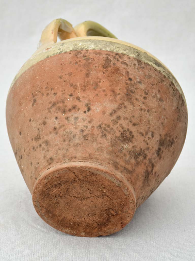 Small antique French water pitcher with yellow glaze 11"