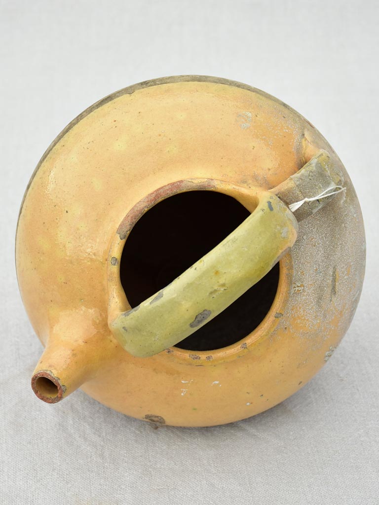 Small antique French water pitcher with yellow glaze 11"