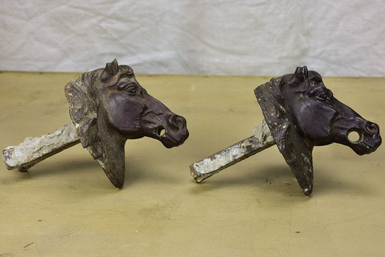 Pair of antique French cast iron horse heads