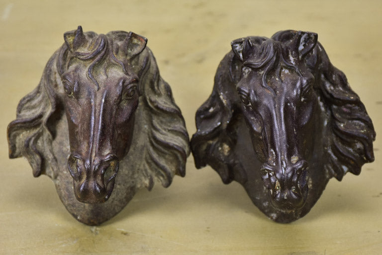 Pair of antique French cast iron horse heads