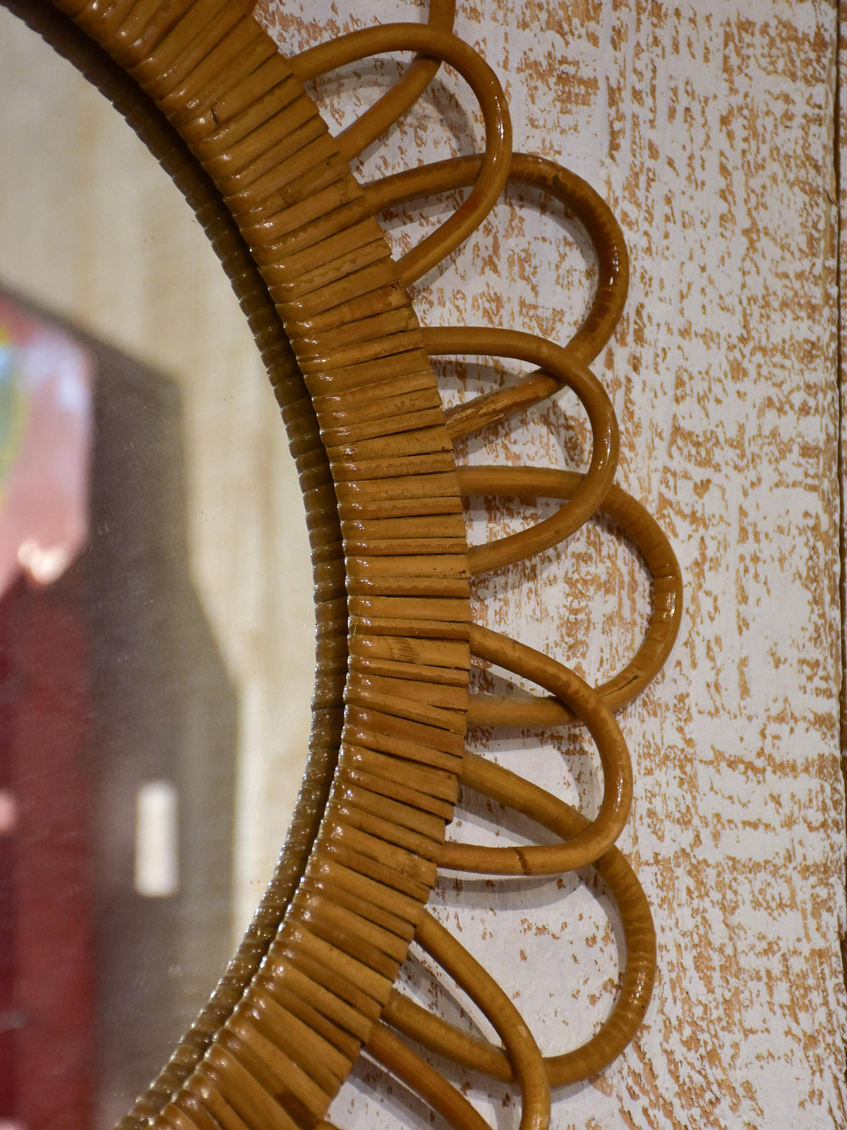 Vintage French sunburst mirror with wicker frame