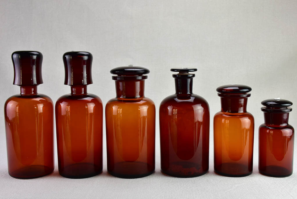 Vintage amber-glass pharmacy jars collection