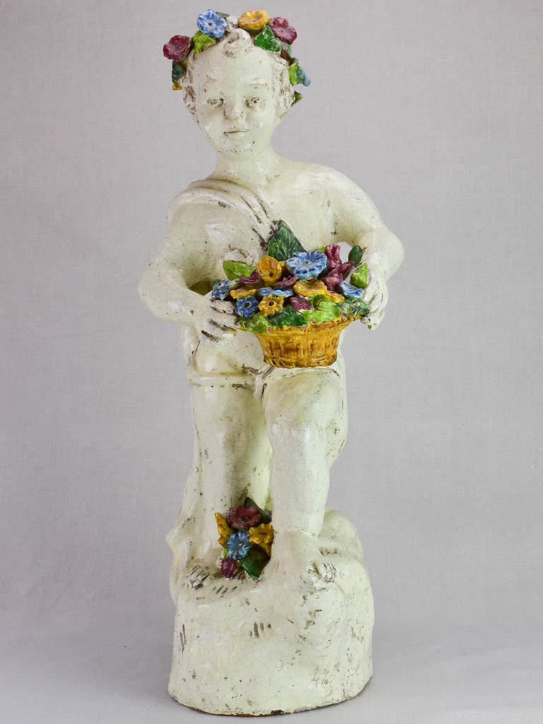Mid century faience Putto with colorful flowers 26"