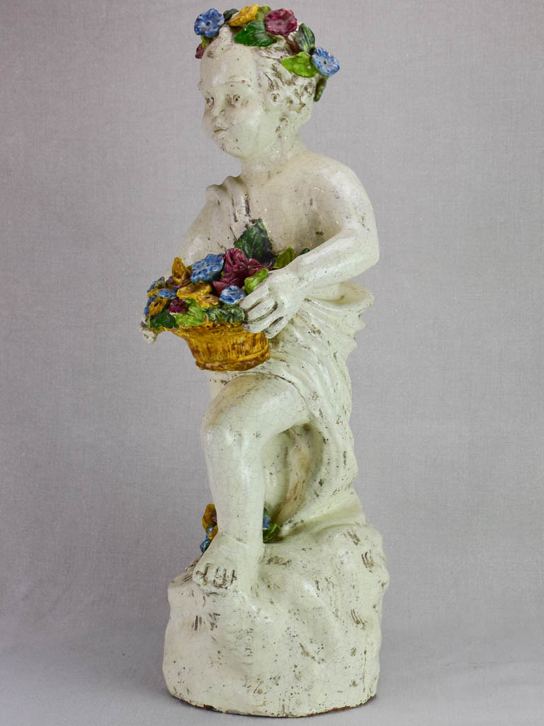 Mid century faience Putto with colorful flowers 26"